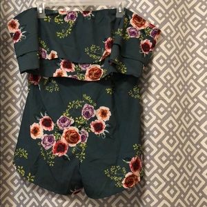 Green romper with pink, red, and purple flowers